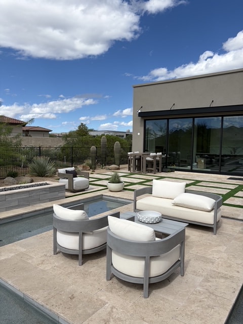 Modern patio with lounge furniture and pool
